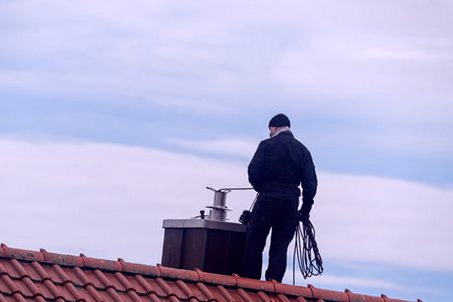 Sweep on the roofline with his rotary rig and coiled line
